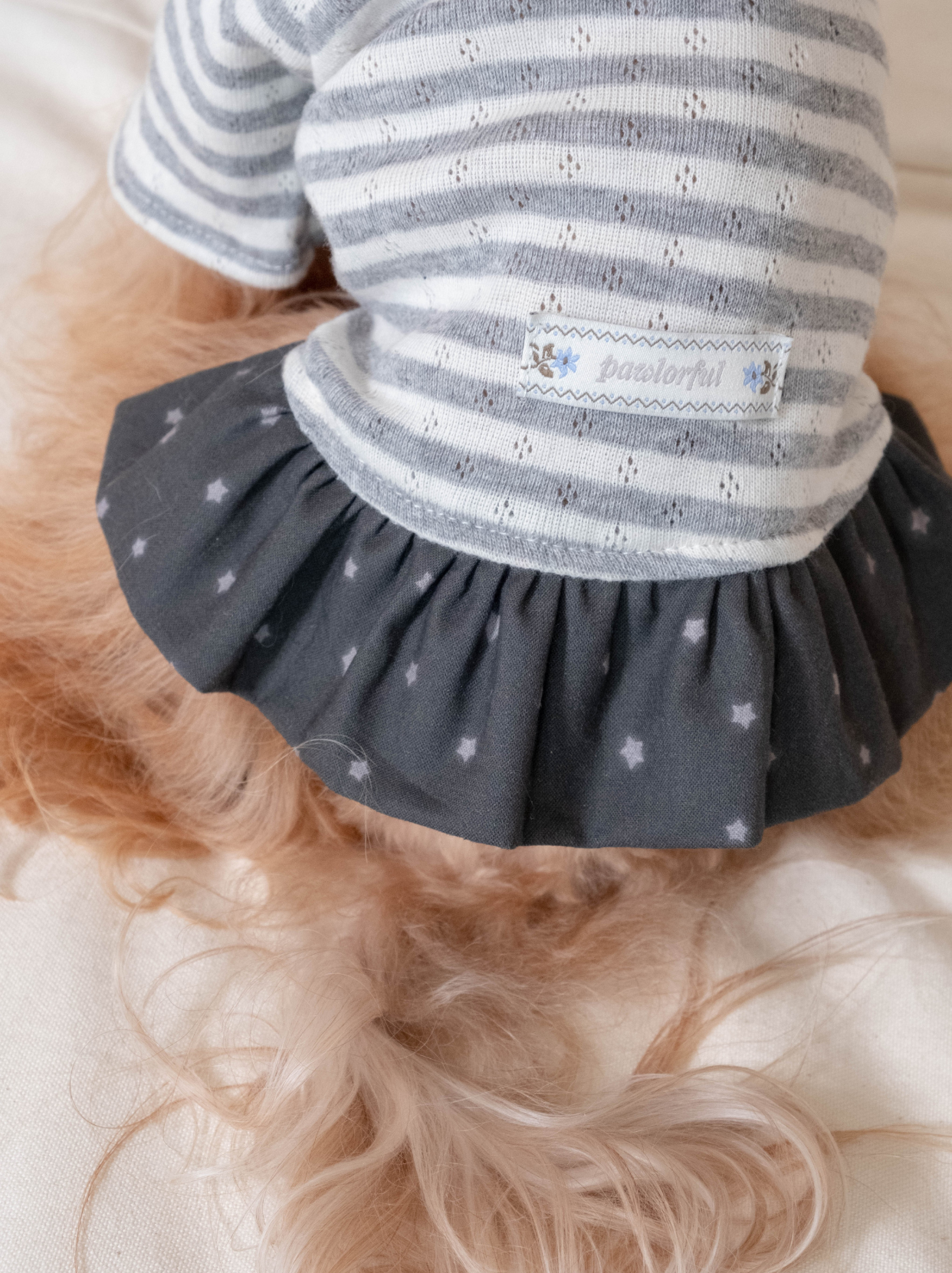 Close-up of dark gray cotton skirt with star print on dog dress