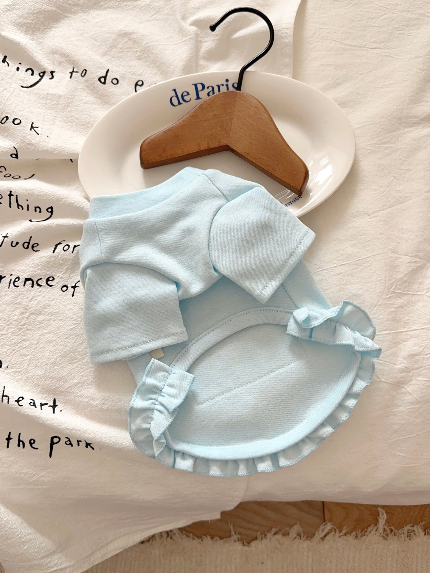 Back view of lightweight blue pet top