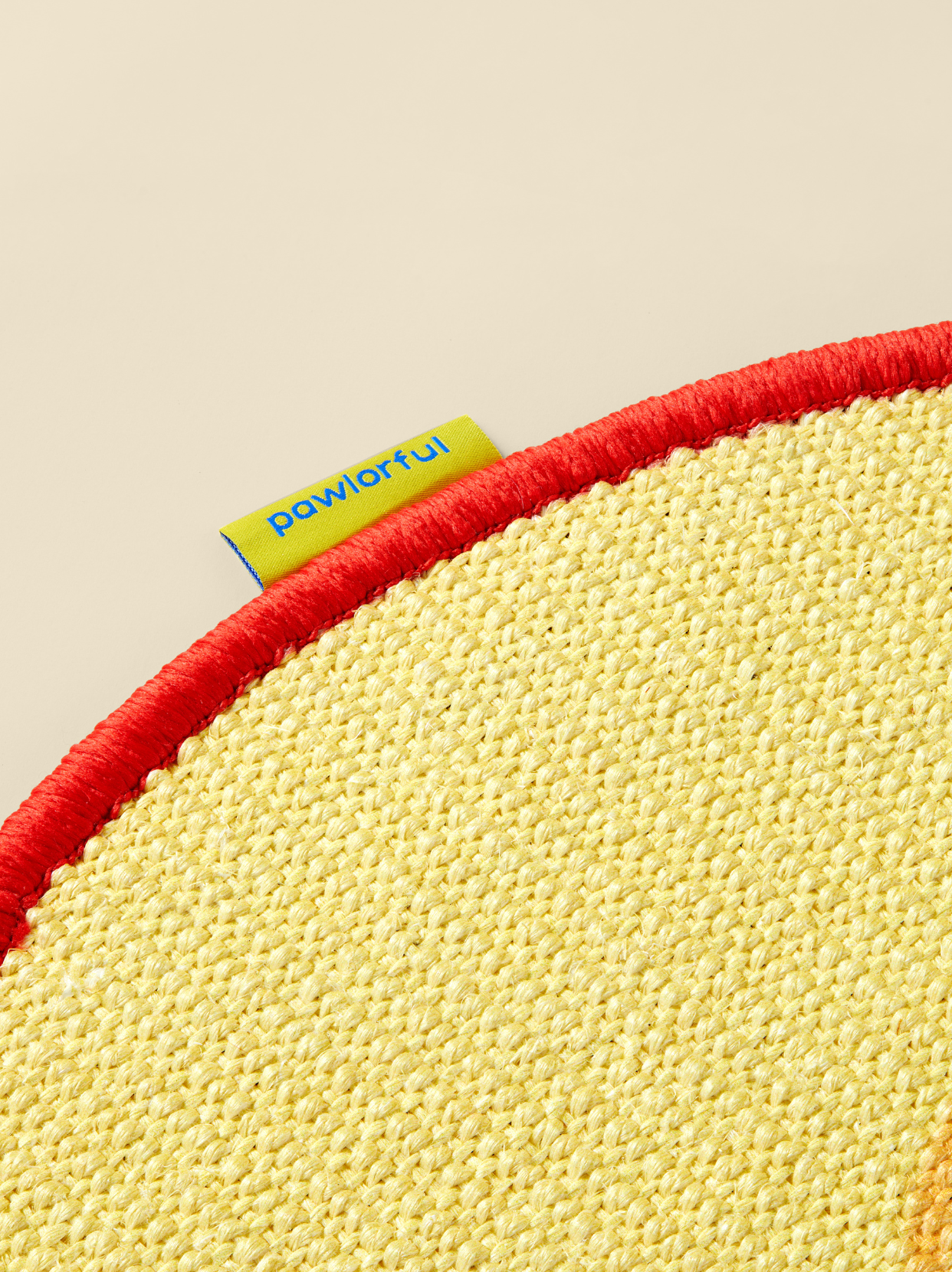 Close-up texture of natural sisal fibers in apple-shaped cat scratch mat