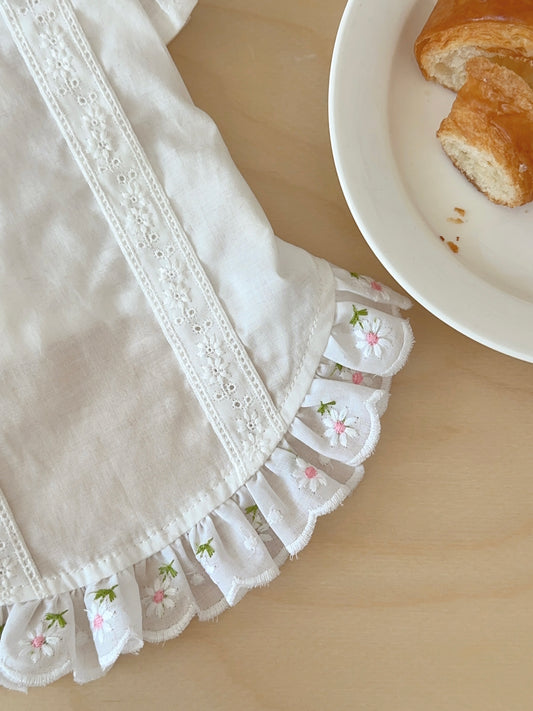 Fabric and stitching detail of Pawlorful white dog shirt